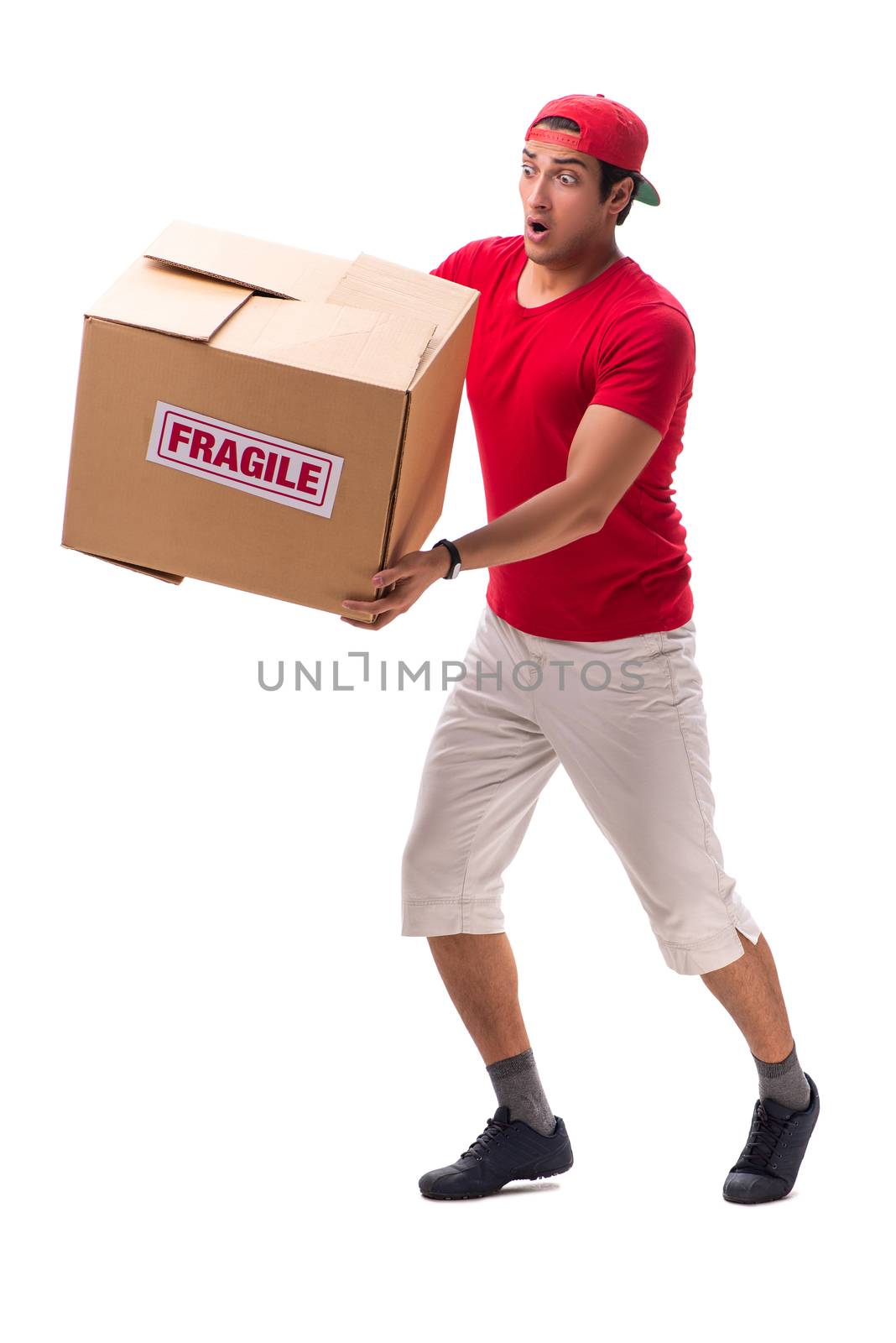 Handsome contractor holding fragile box isolated on white 