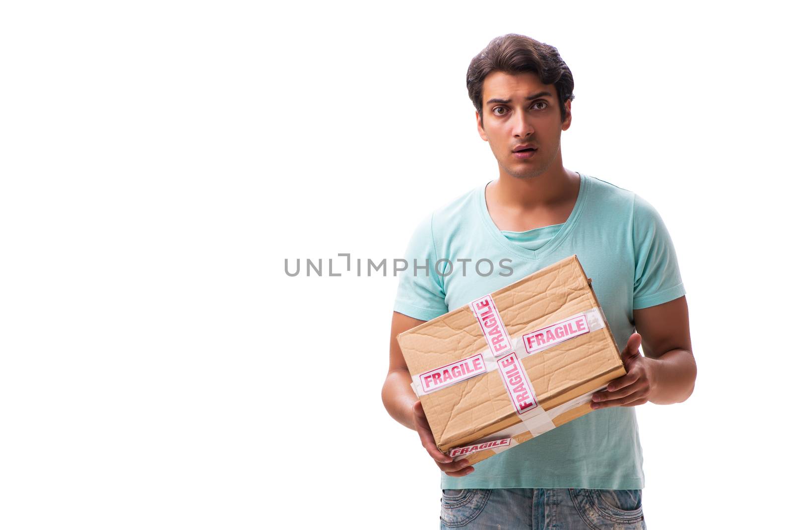 Young handsome man with fragile box ordered from Internet 
