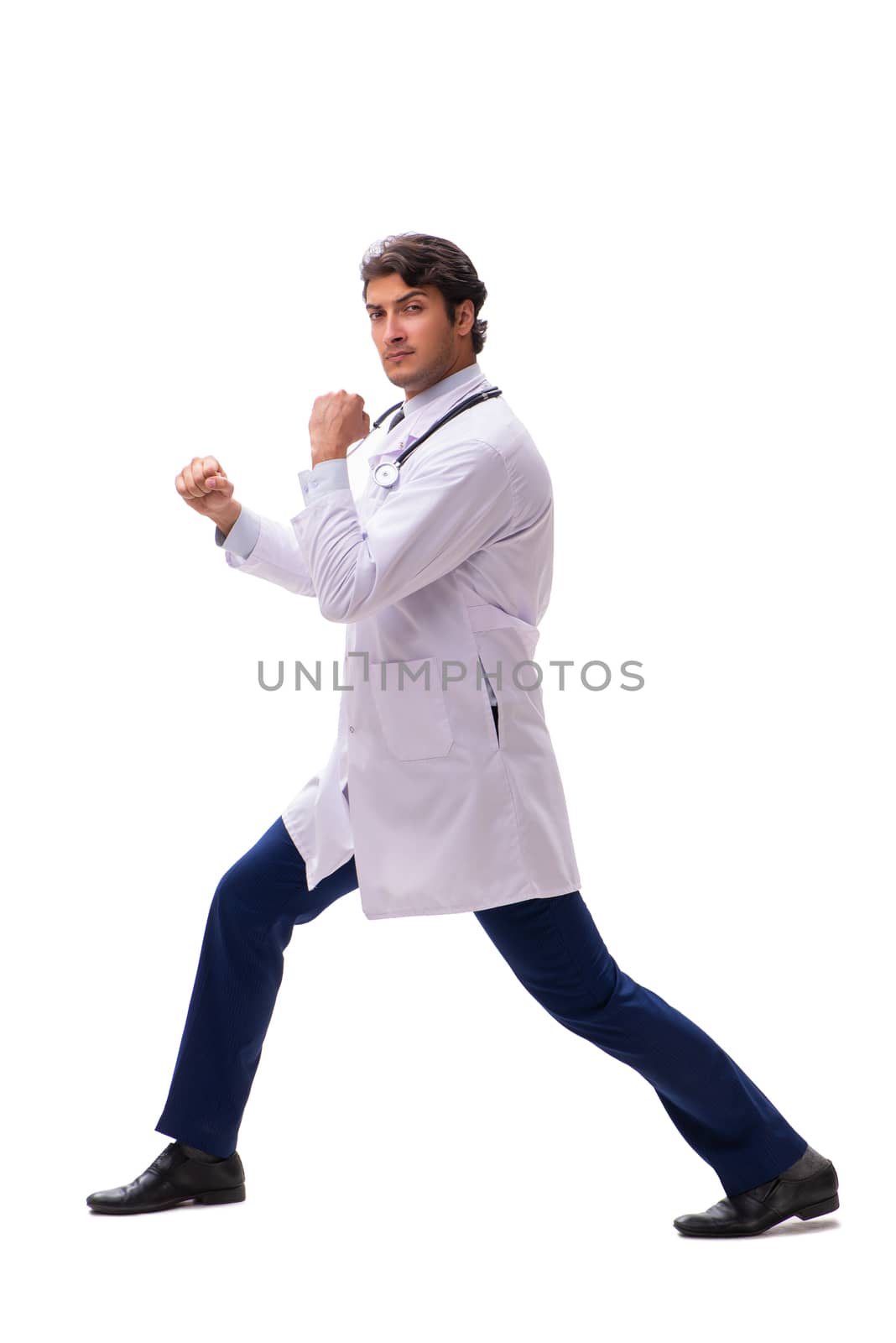 Young handsome doctor under pressure isolated on white