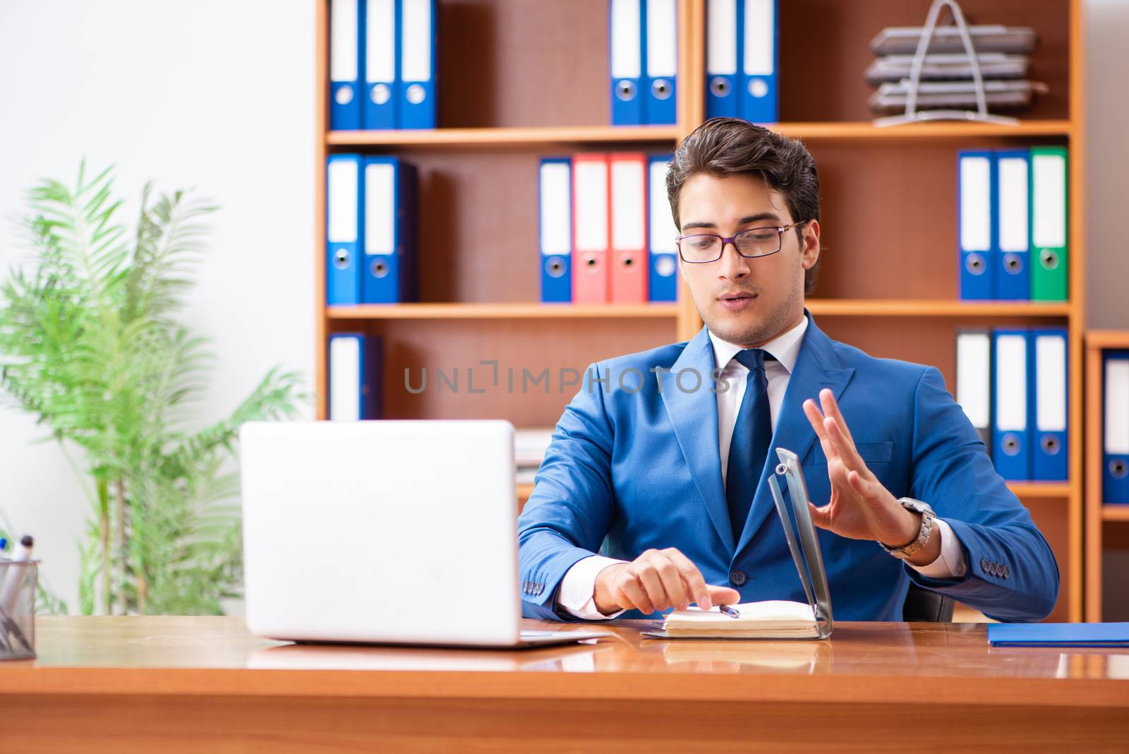 Young employee working in the office