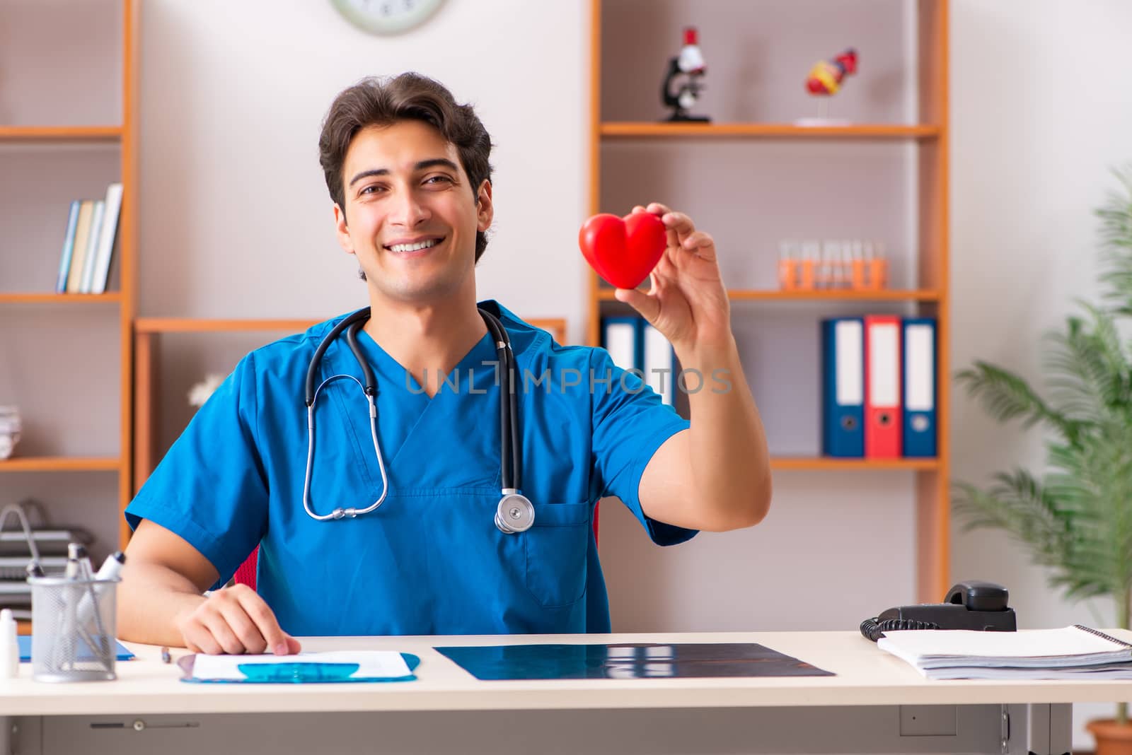 Young handsome doctor radiologyst working in clinic 