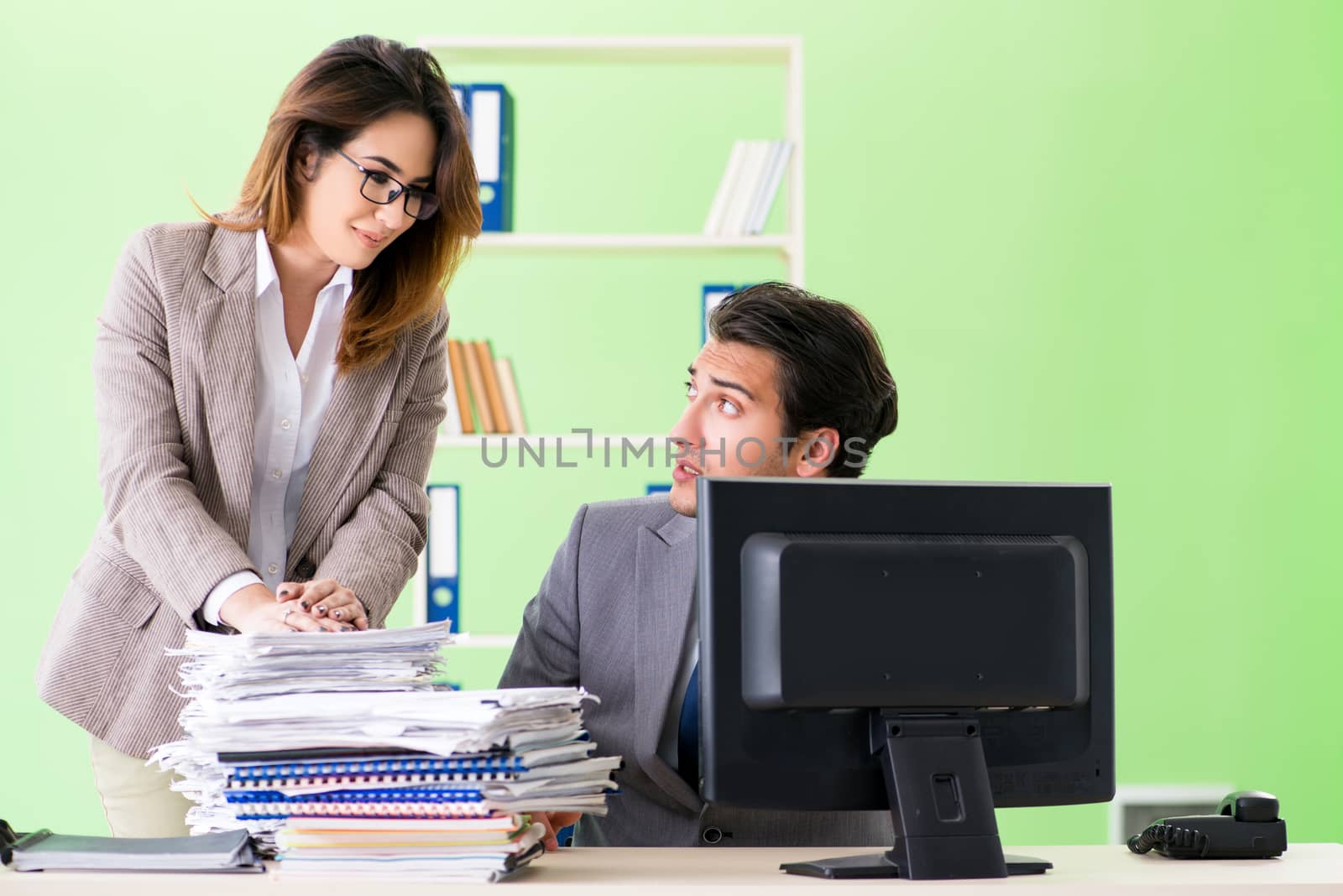 Two colleagues working in the office