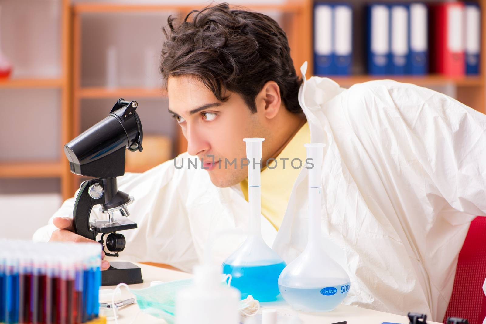 Young biochemist working in the lab 
