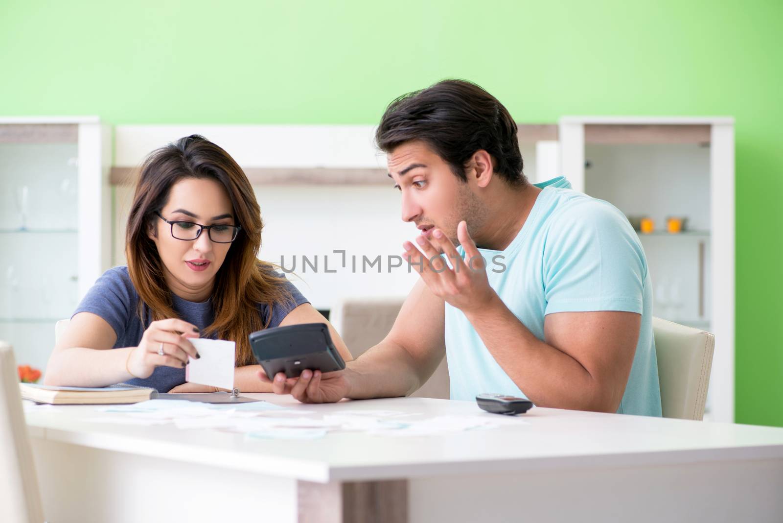 Young family struggling with personal finance by Elnur