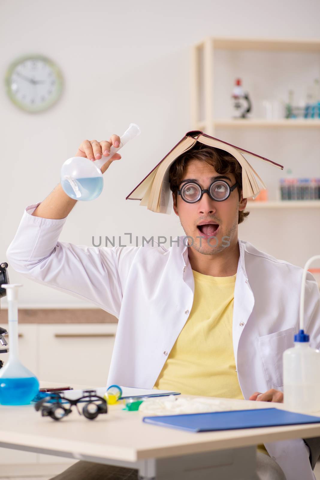 Funny crazy chemist doing experiments and tests