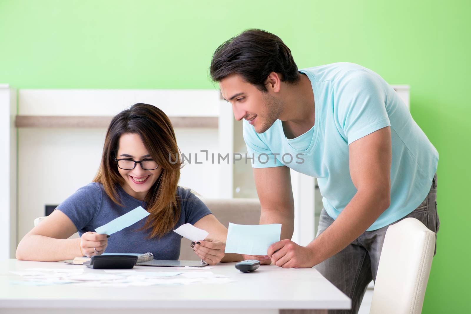 Young family struggling with personal finance by Elnur