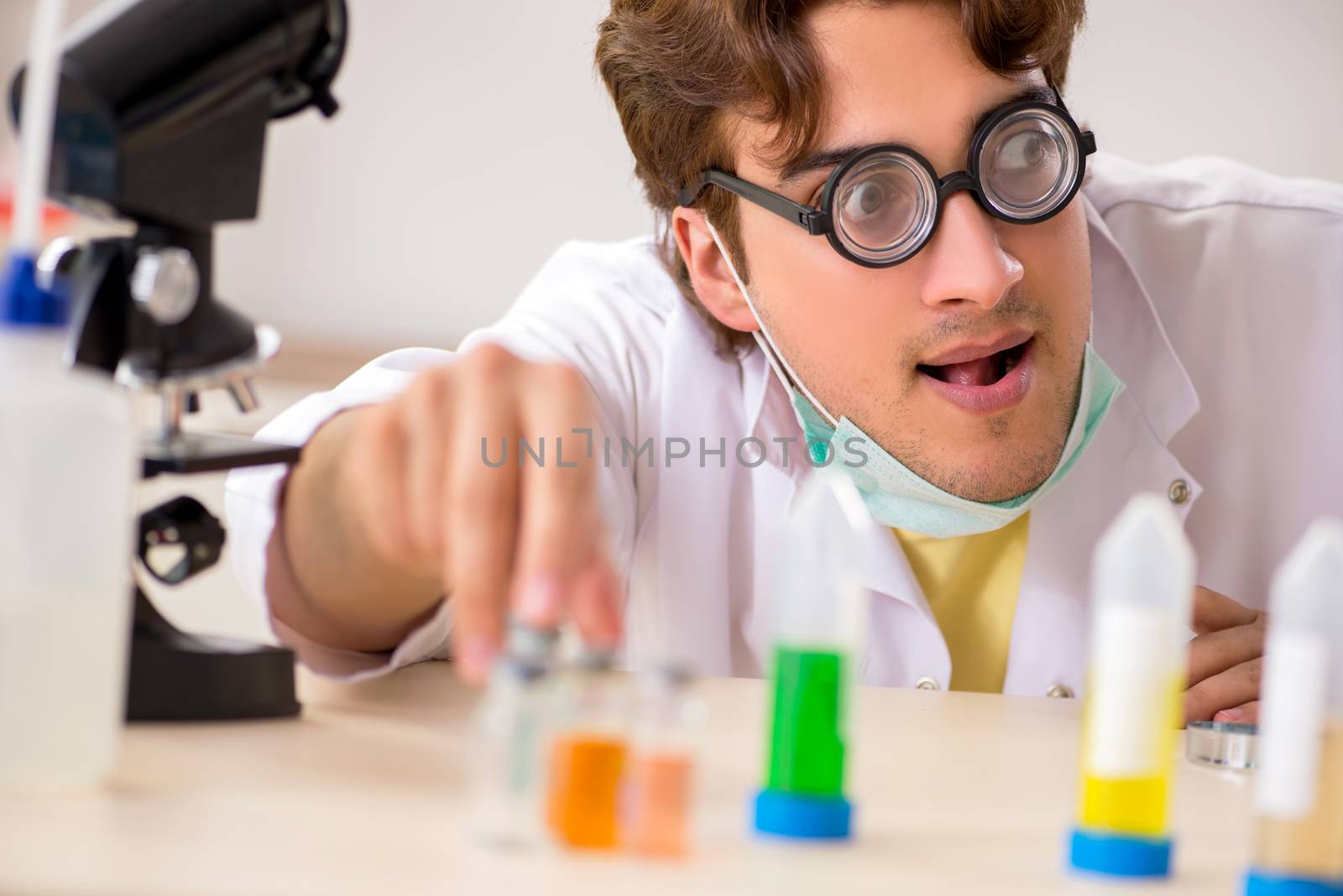 Funny crazy chemist doing experiments and tests by Elnur