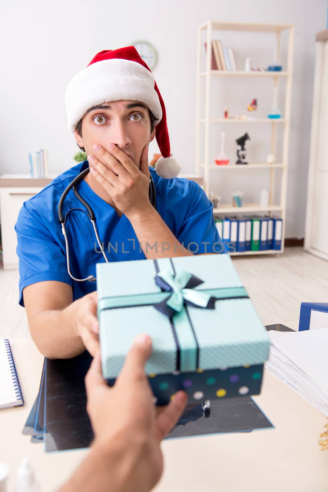 Doctor with gift box in the hospital