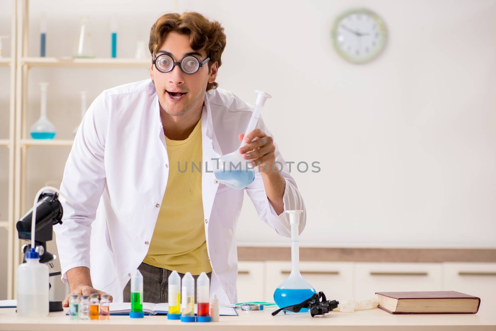 Funny crazy chemist doing experiments and tests by Elnur