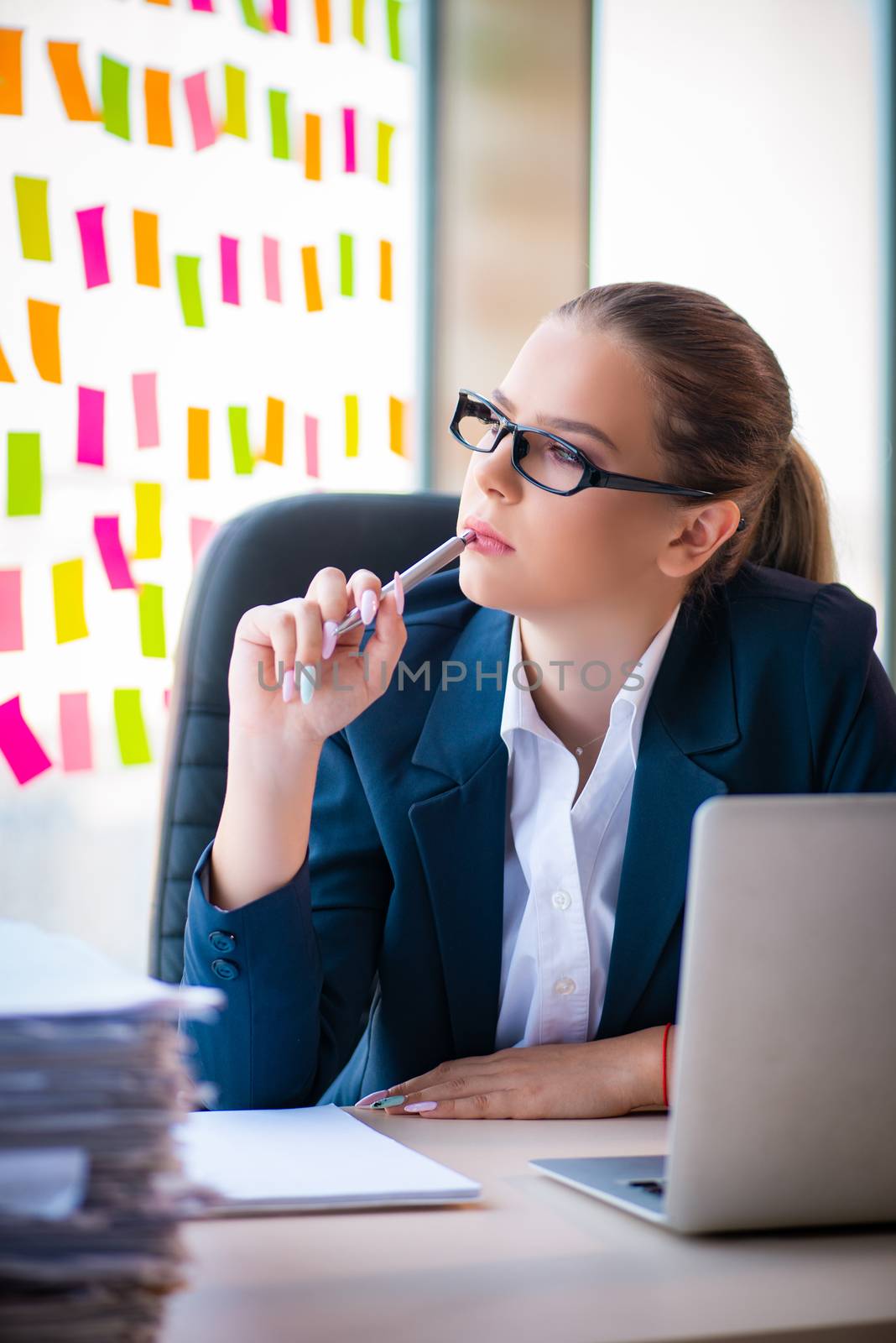 Beautiful female employee with many conflicting priorities 