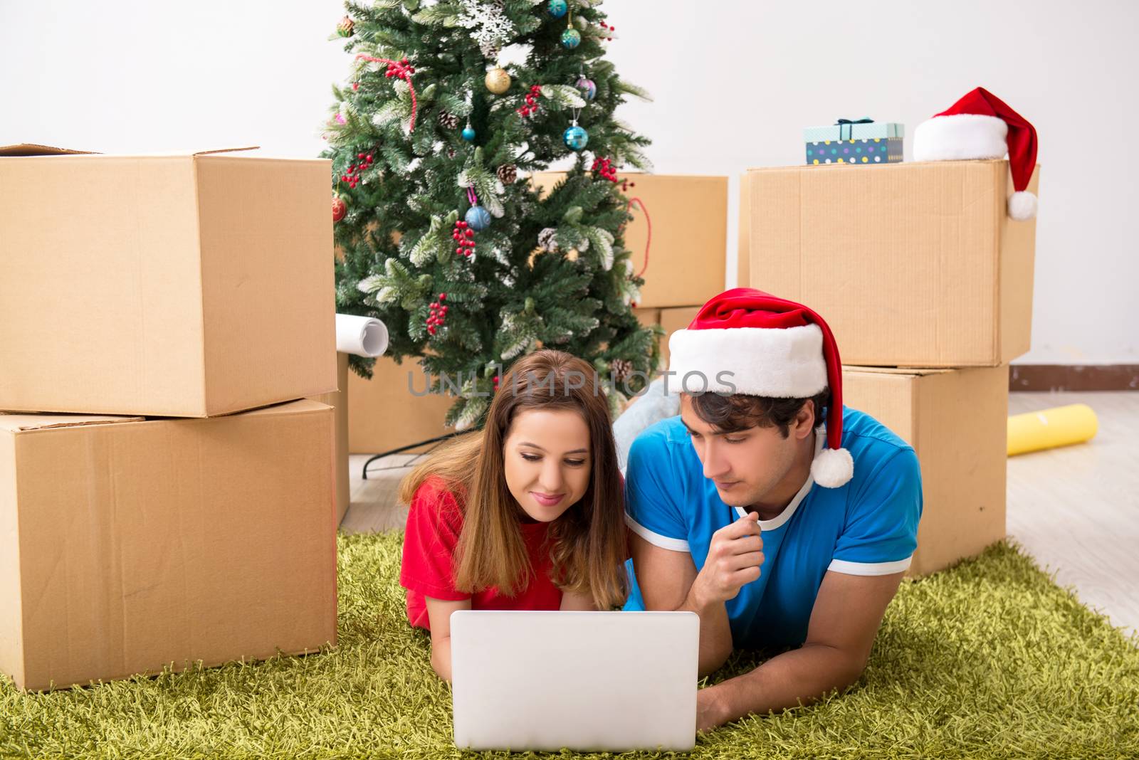 Young family celebrating christmas in new home