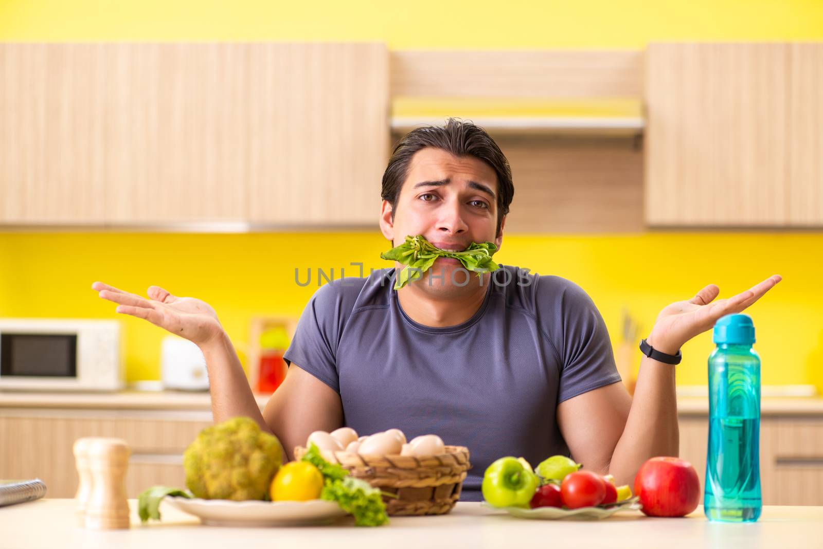 Young man in dieting and healthy eating concept