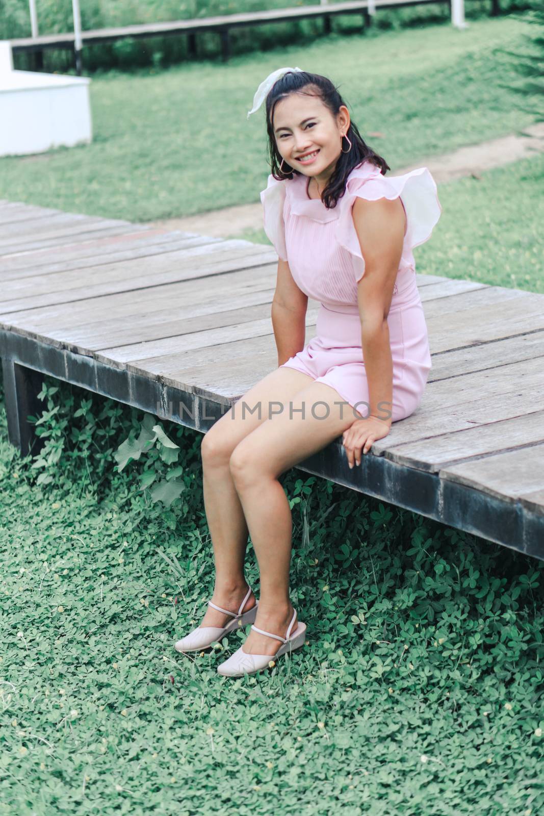 Portrait of asian happy woman smilling with nature garden , Selective focus