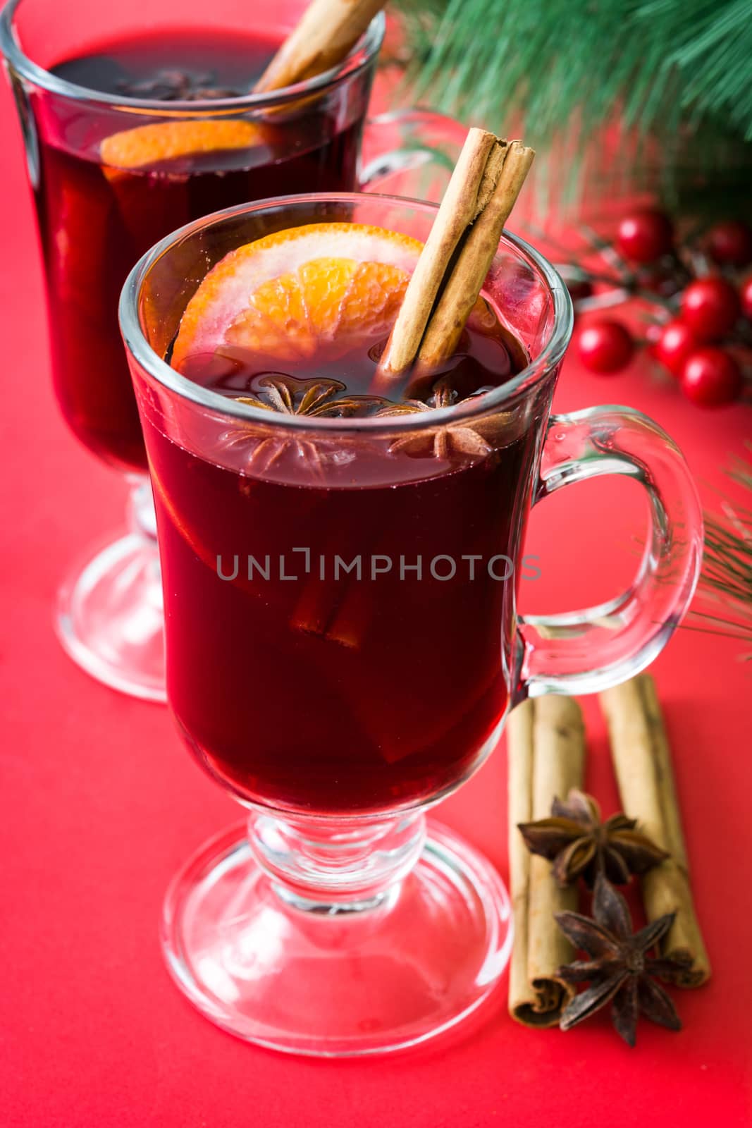 Christmas mulled wine on red background by chandlervid85