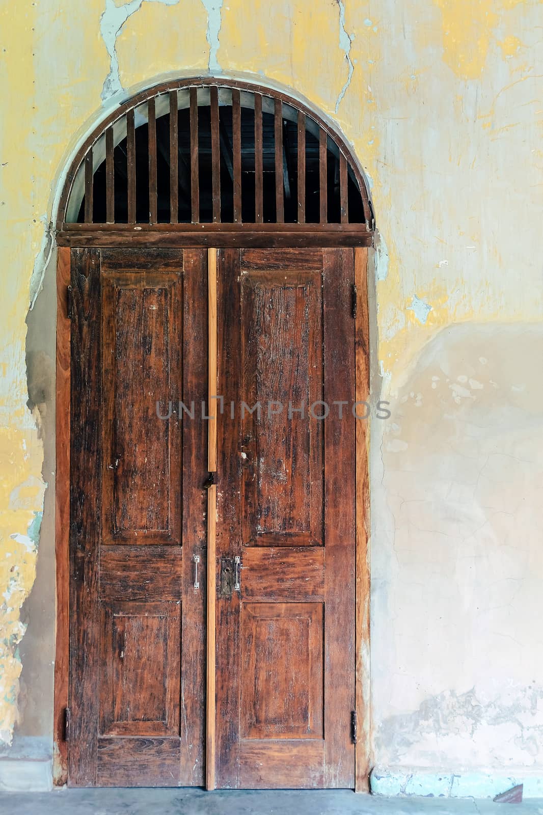 A ancient door,classical architecture building detail by ponsulak