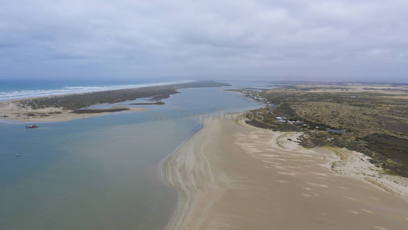 Aerial view of the mouth of the River Murray in regional South Australia in Australia by WittkePhotos