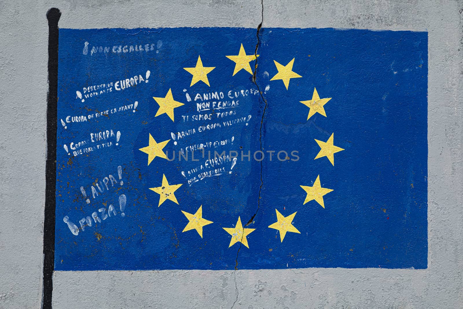 Flag of the European Union painted on a gray wall in Vicedo, Spain by alvarobueno