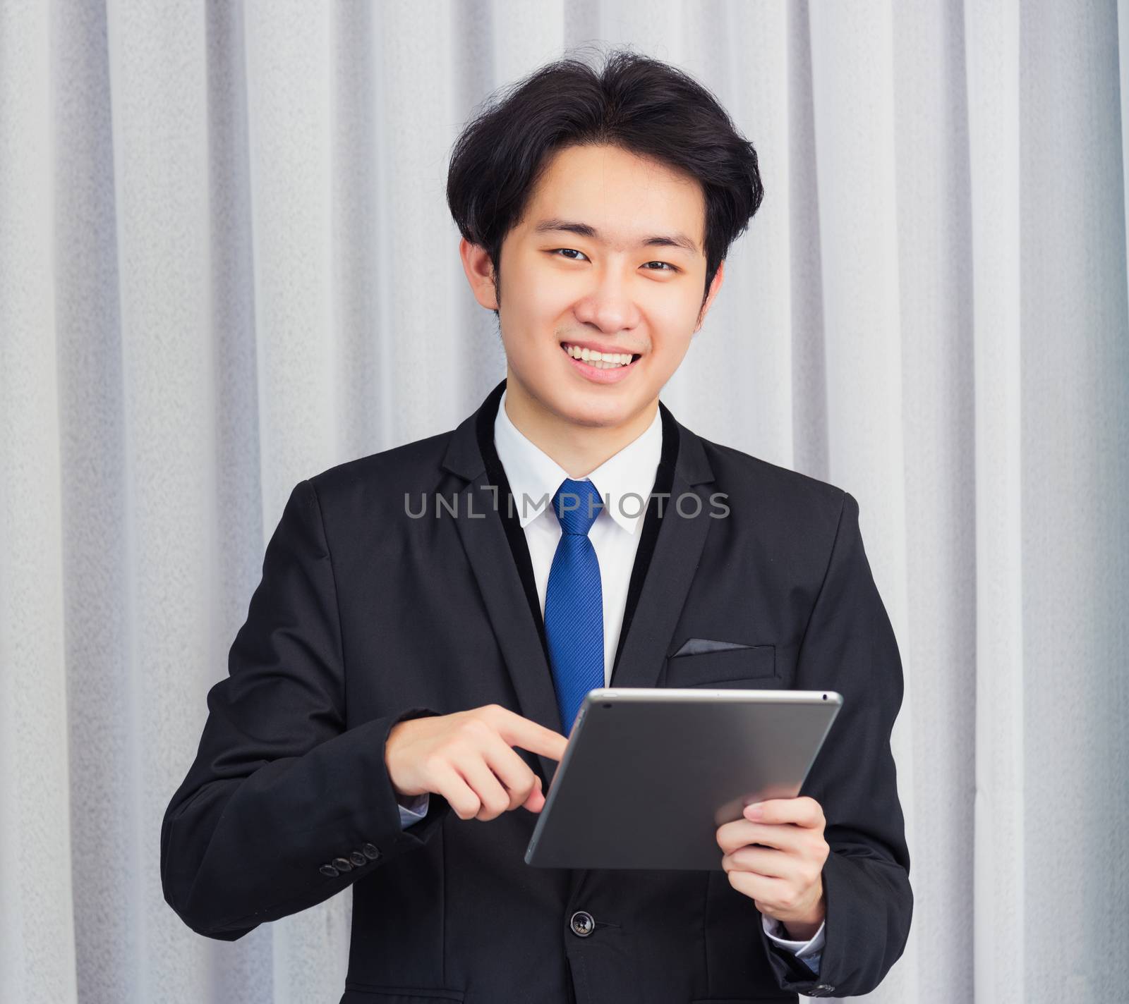 Businessman video conference call using smart digital tablet com by Sorapop