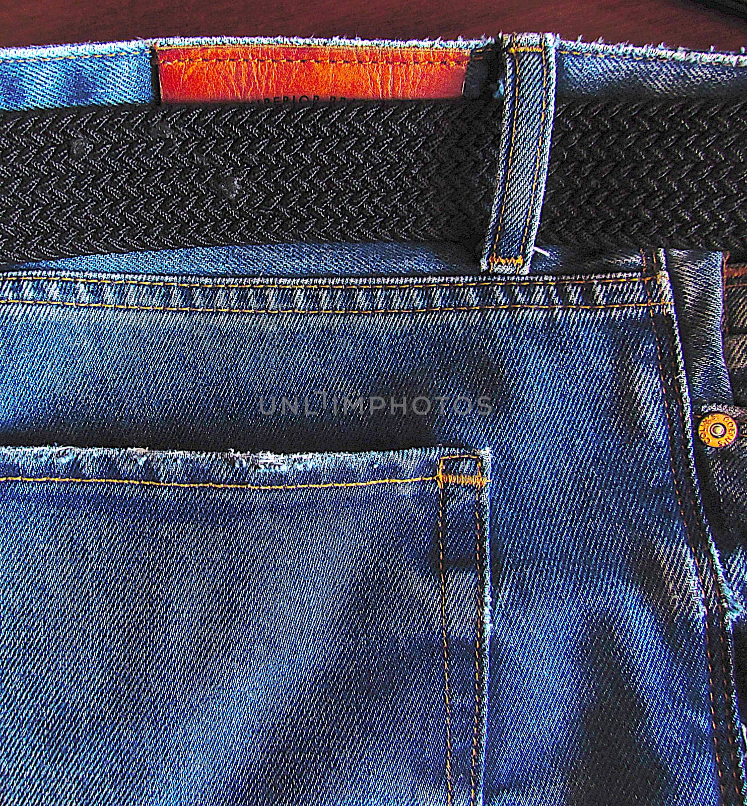 texture of denim, denim material with pockets and a fabric belt close-up