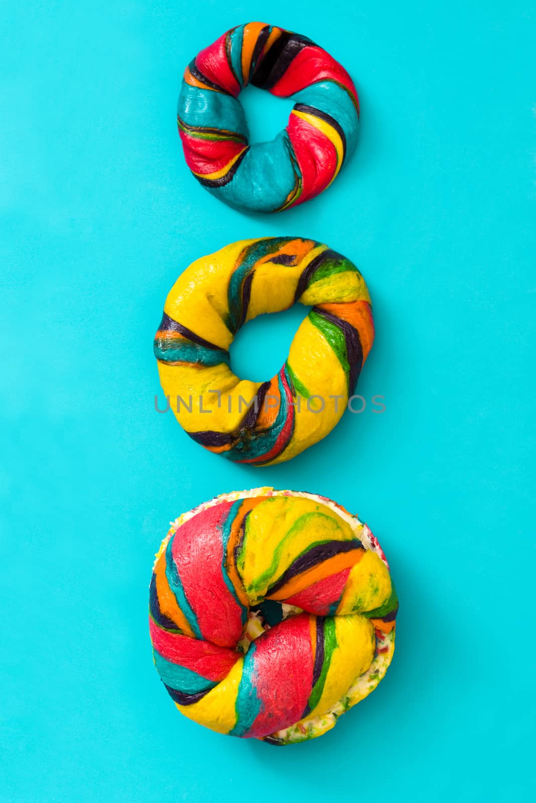 Colorful bagel on blue background by chandlervid85
