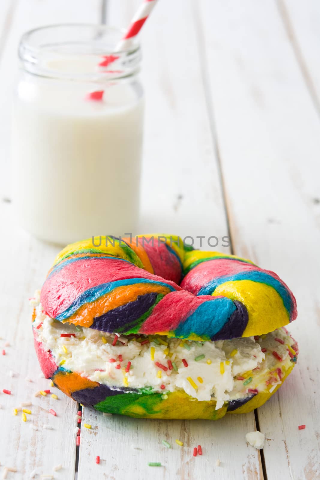 Colorful bagel with cheese and sprinkles