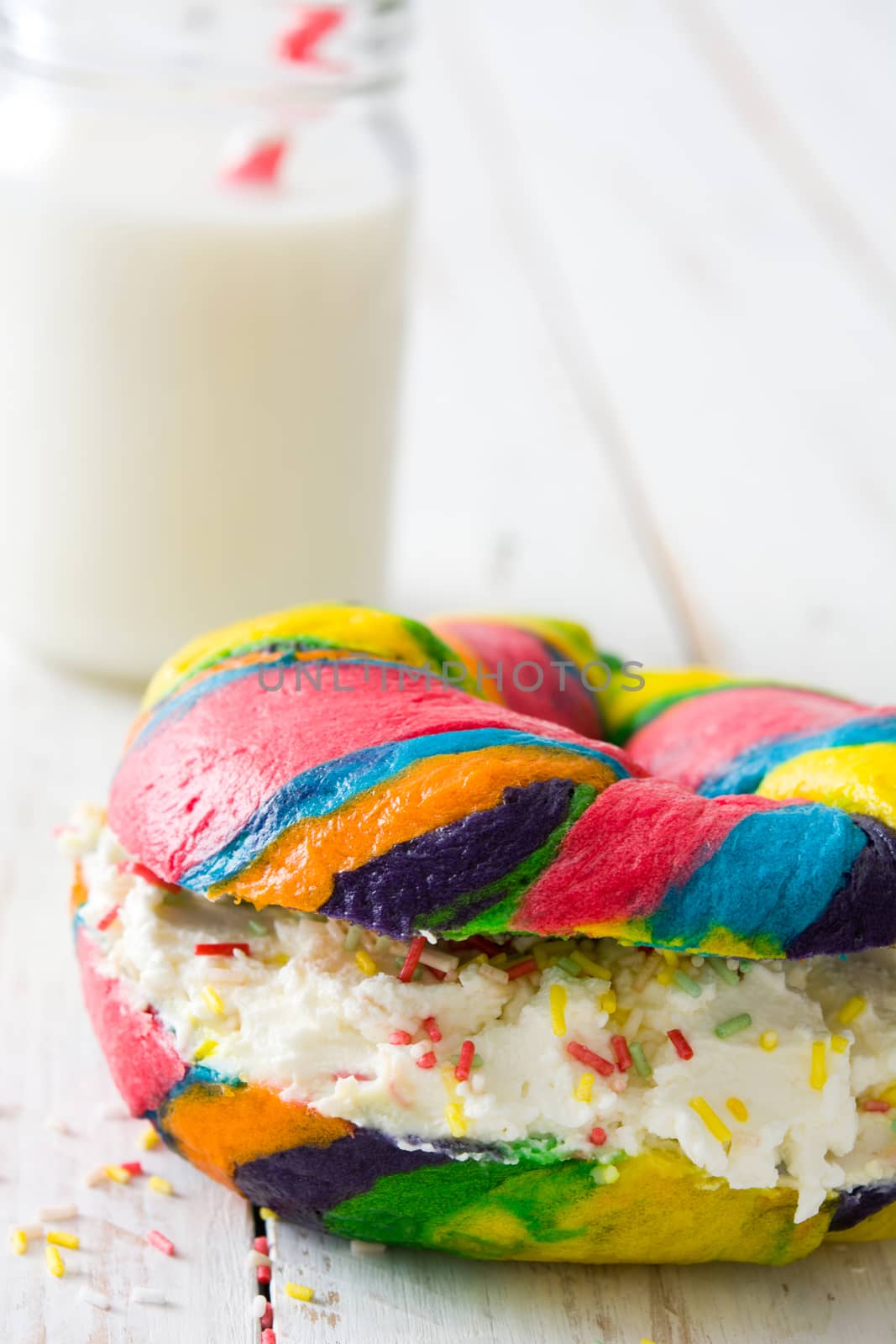 Colorful bagel with cheese and sprinkles by chandlervid85