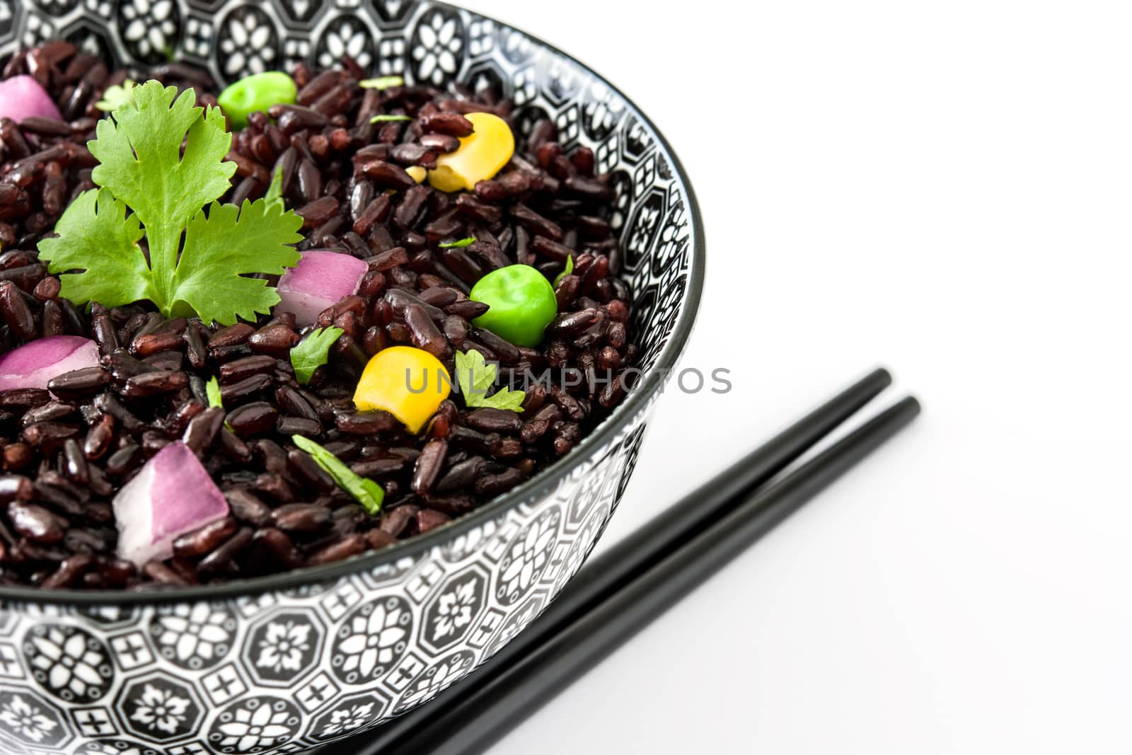 Black rice and vegetables isolated on white background by chandlervid85