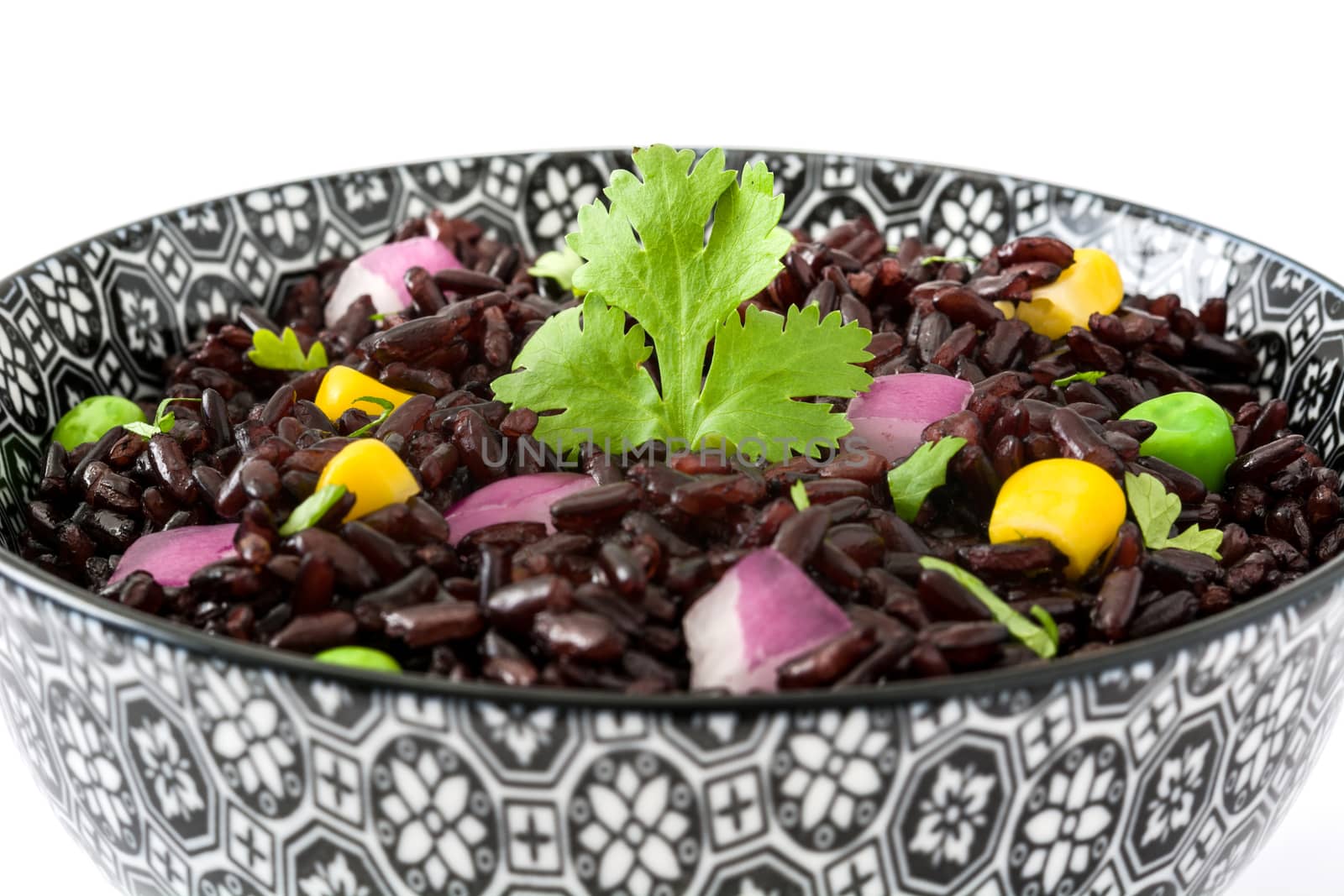 Black rice and vegetables isolated on white background