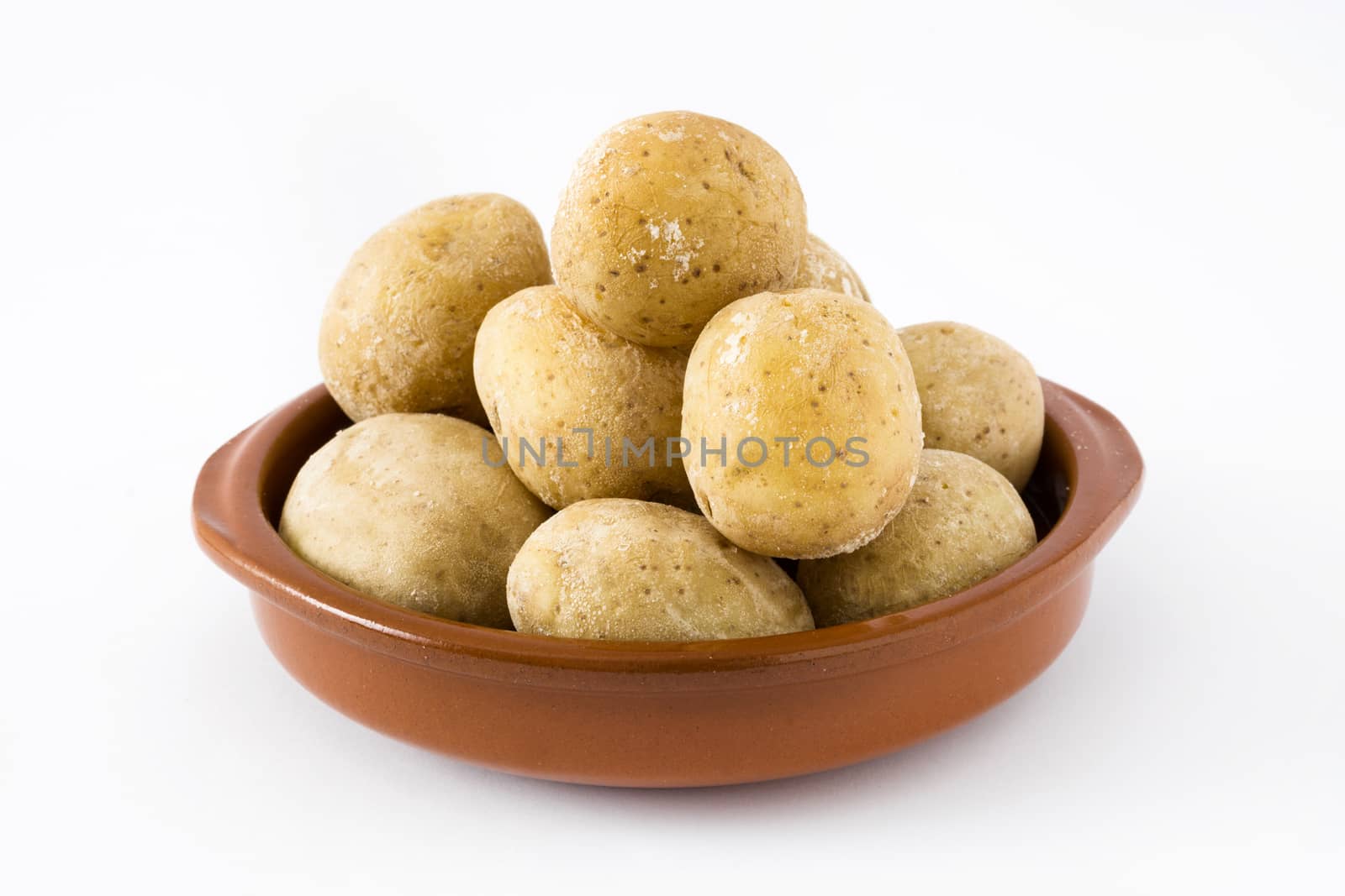 Canarian potatoes (papas arrugadas) isolated on white background