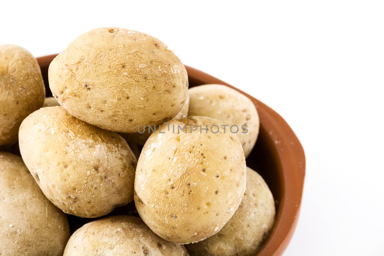 Canarian potatoes (papas arrugadas) isolated on white background