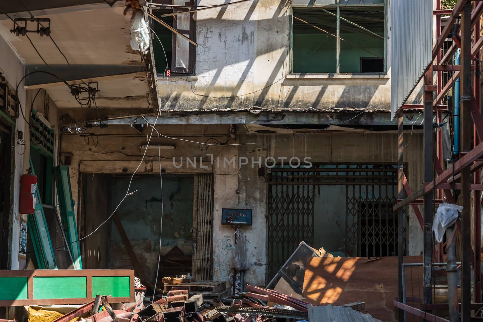 External of old house was left to deteriorate over time, Chinese Architecture style, Abandoned house, Destroyed house, Ruined house, Selective focus.
