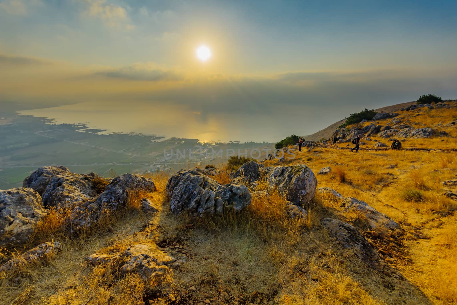 Arbel, Israel - August 14, 2020: Morning view of the Sea of Galilee, from mount Arbel, with visitors. Northern Israel