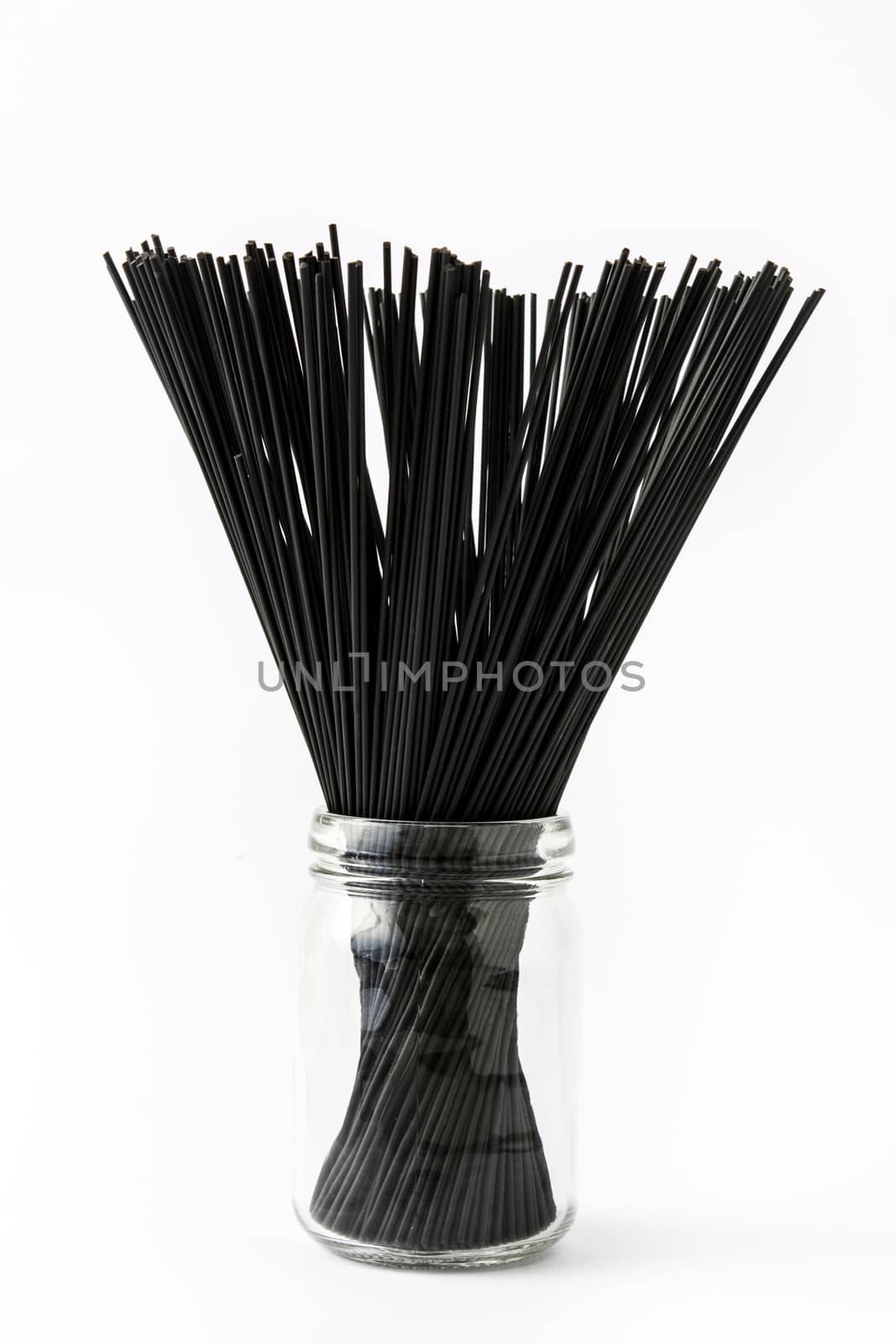 Black spaghetti with prawns isolated on white background by chandlervid85