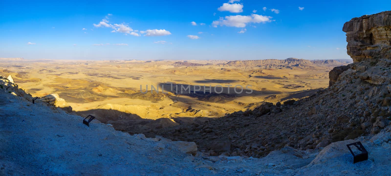 Panoramic view of cliffs and landscape in Makhtesh (crater) Ramon, the Negev Desert, Southern Israel