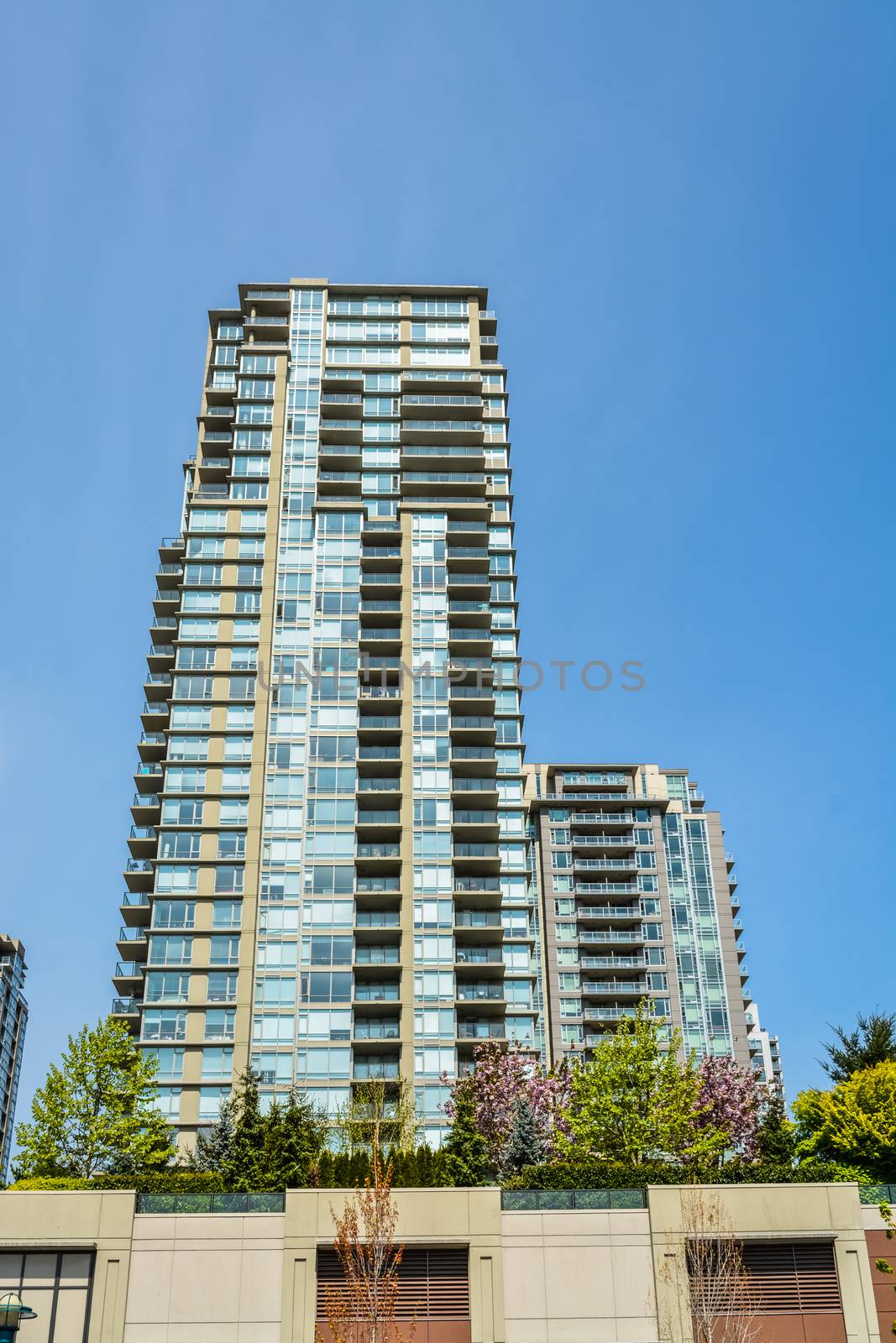 High rise residential building in Vancouver on blue sky background