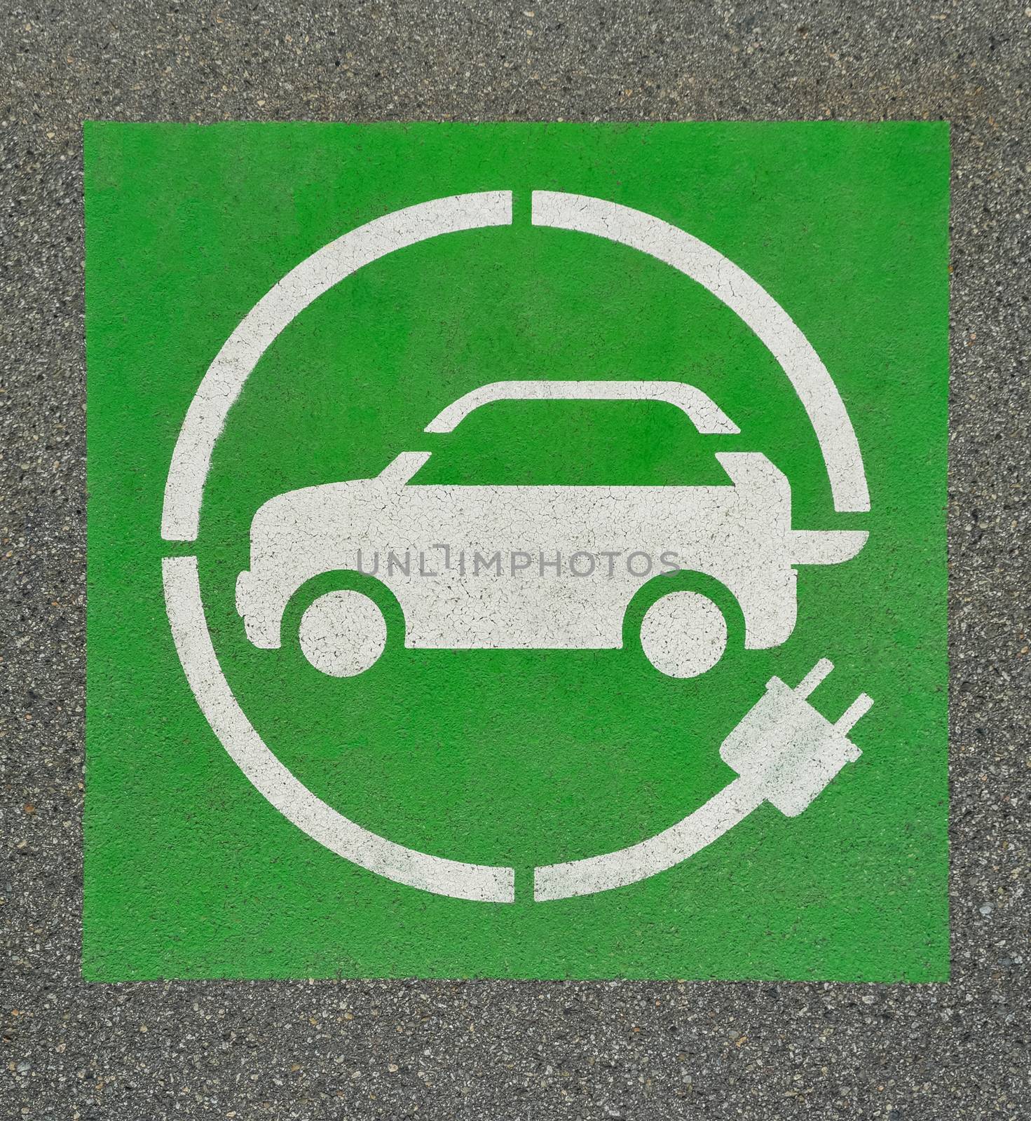 EV - electric vehicle charging station sign on asphalt. 'E' sign on asphalt texture