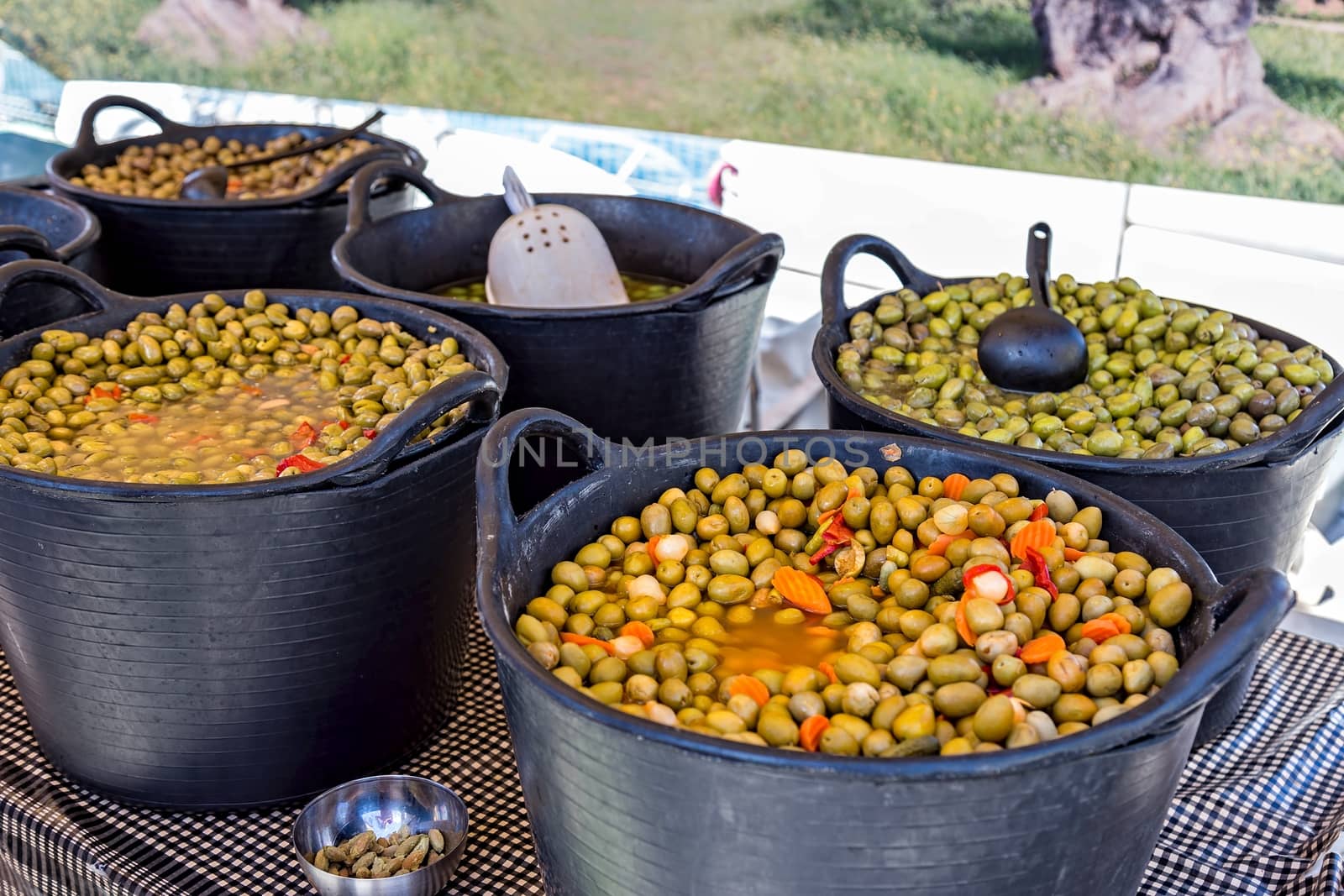 Green olives on the market by Digoarpi