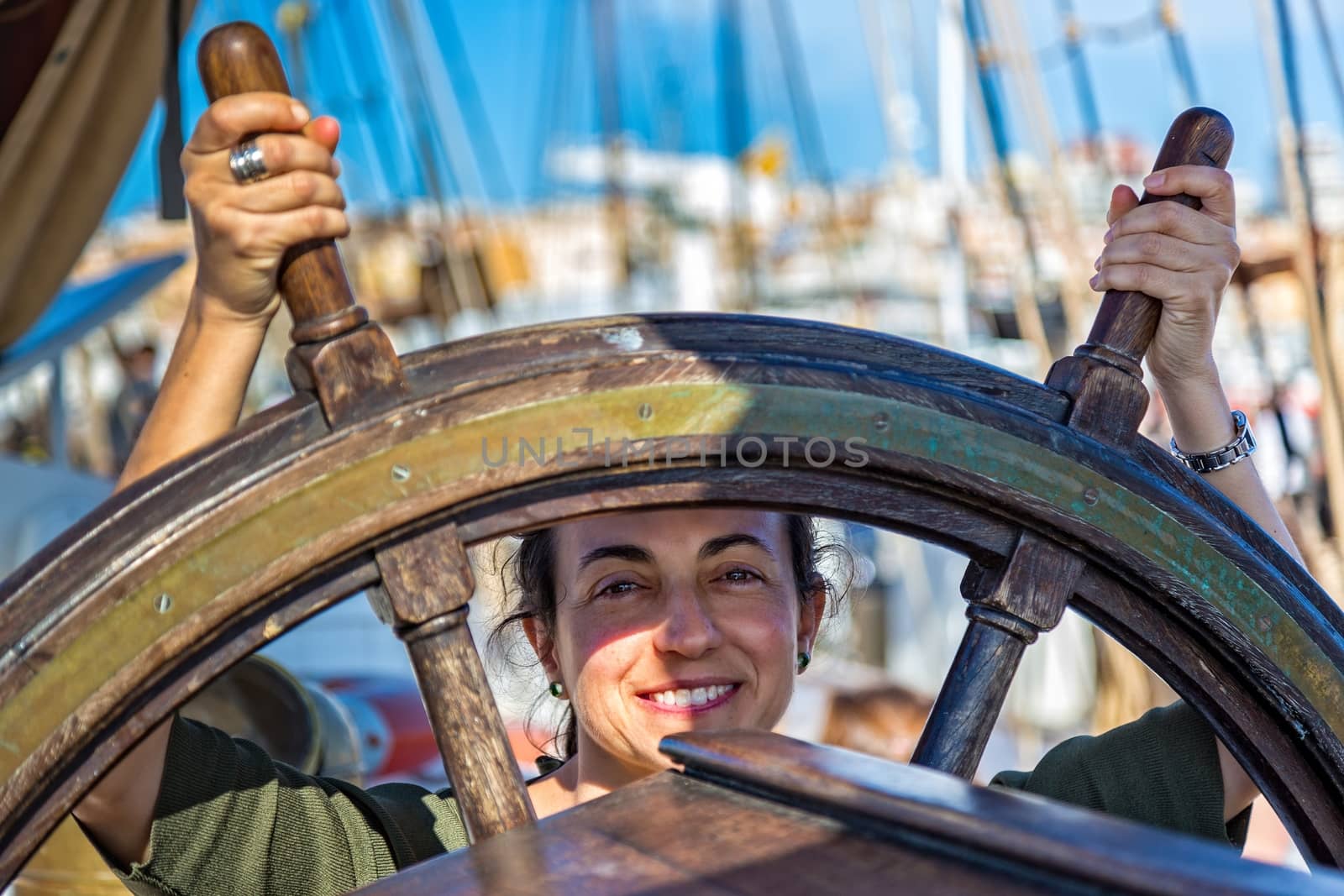 Young girl beside a ship steering by Digoarpi