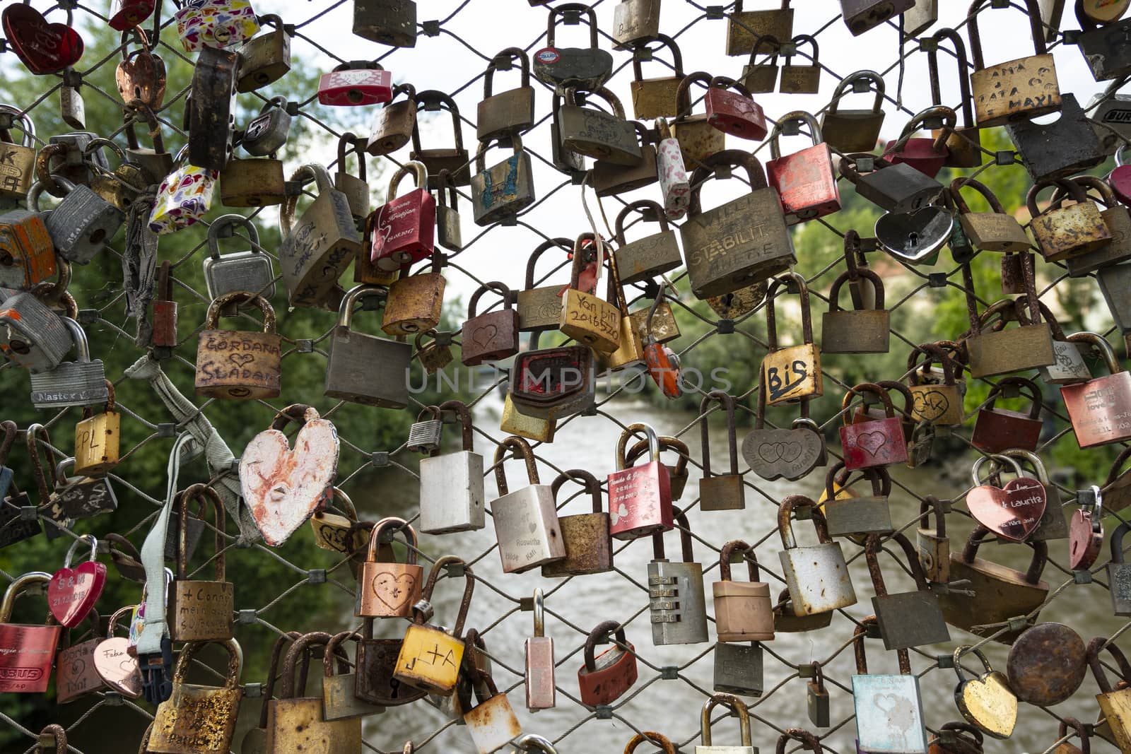 Graz, Austria.  August 2020. padlocks hanging on the Erzherzog Johann bridge over the river Mura