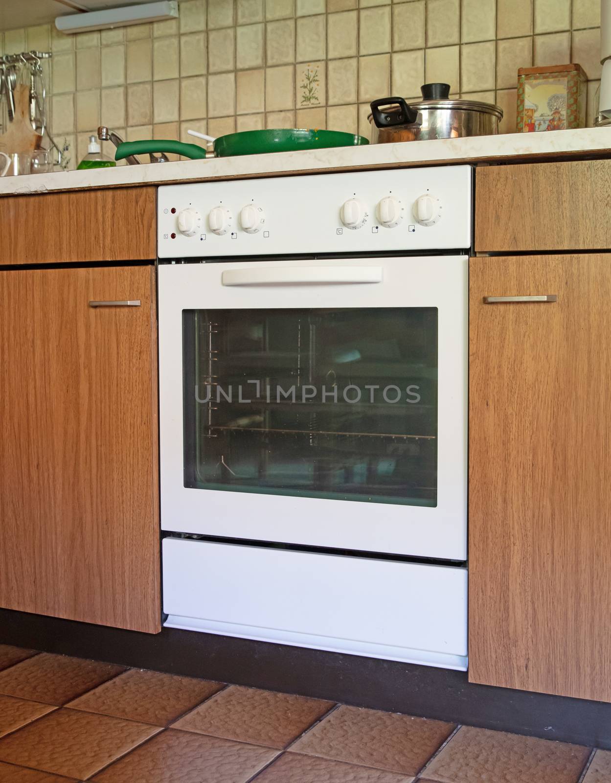 Antique kitchen with dirty oven by michaklootwijk