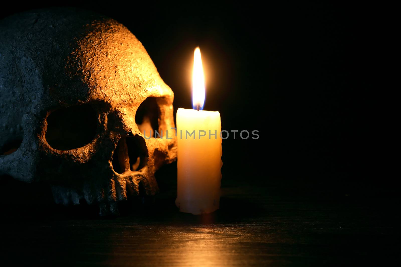 Candle Near Skull by kvkirillov