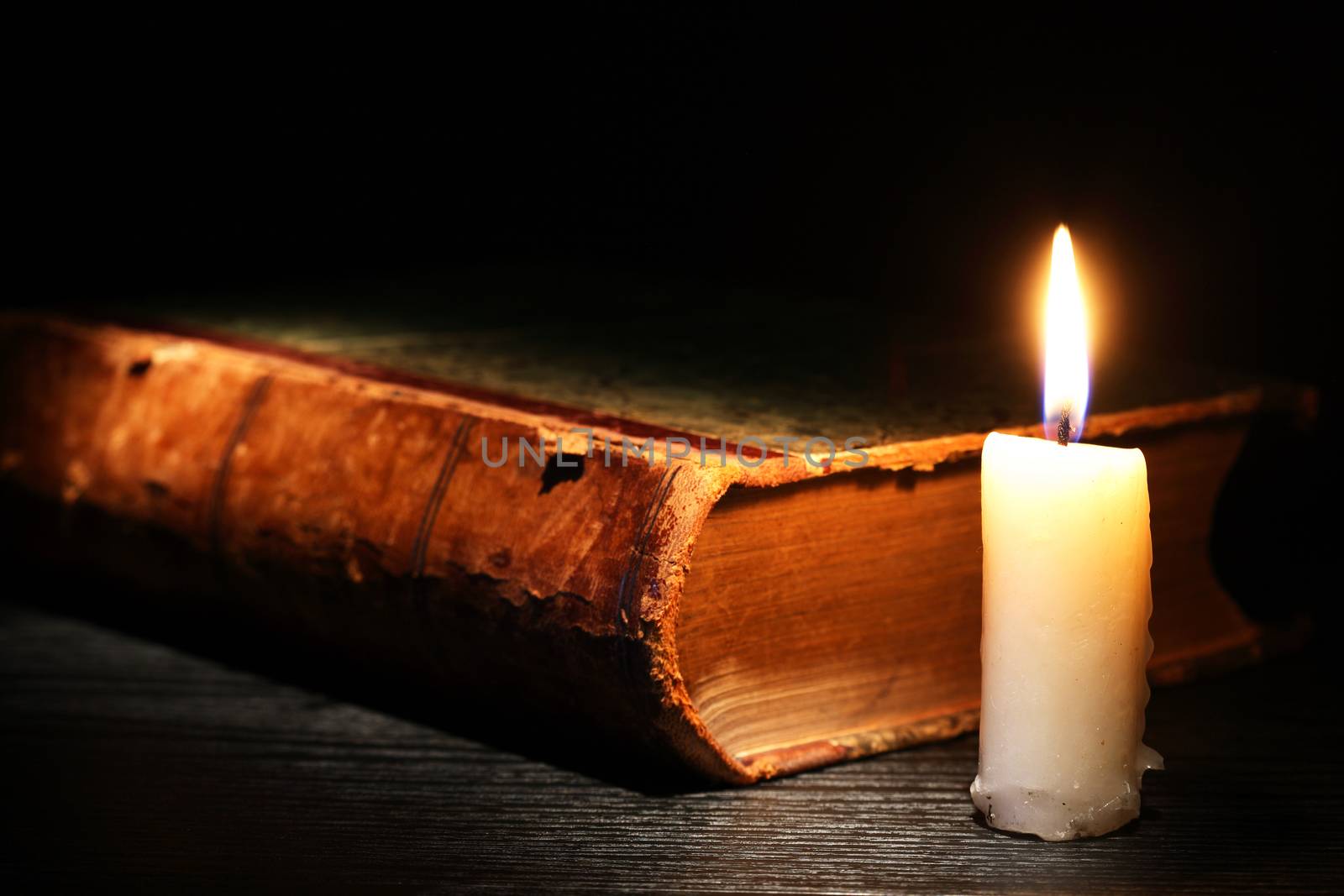 Candle Near Book by kvkirillov