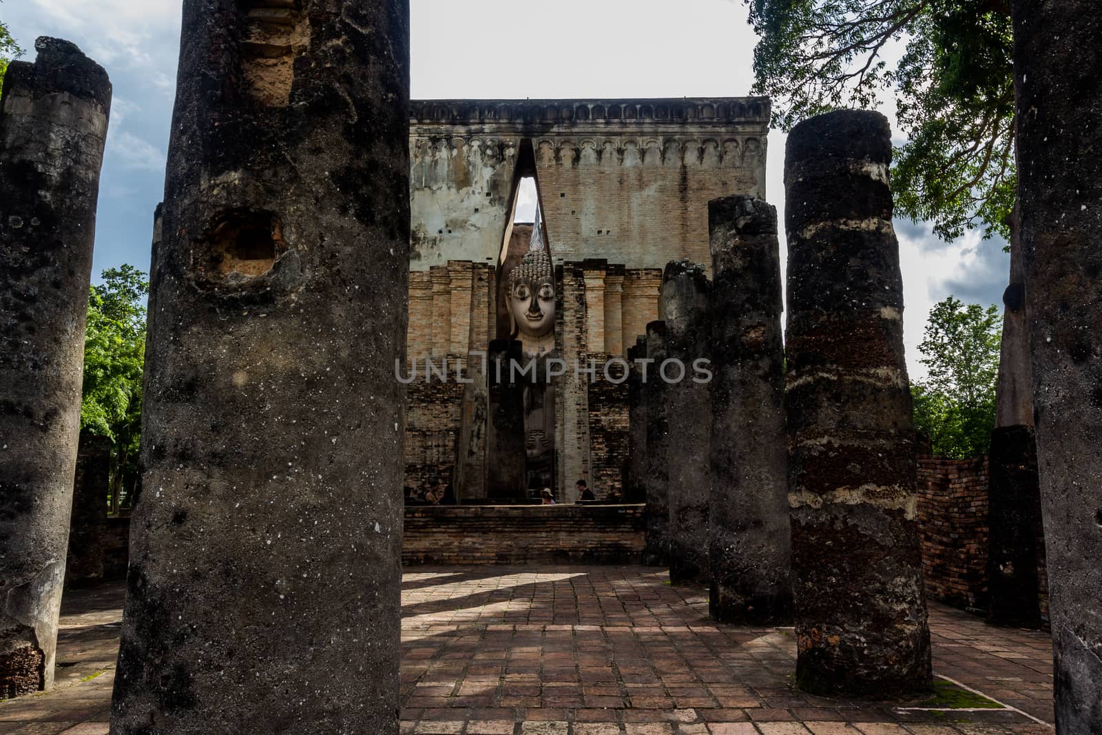 Sri Chum Temple is an ancient monument in the Sukhothai Historical Park. This temple is enshrined by the large Buddha, which is called "Phra Ajarna".  : Sukhothai,Thailand - JULY,01,2018