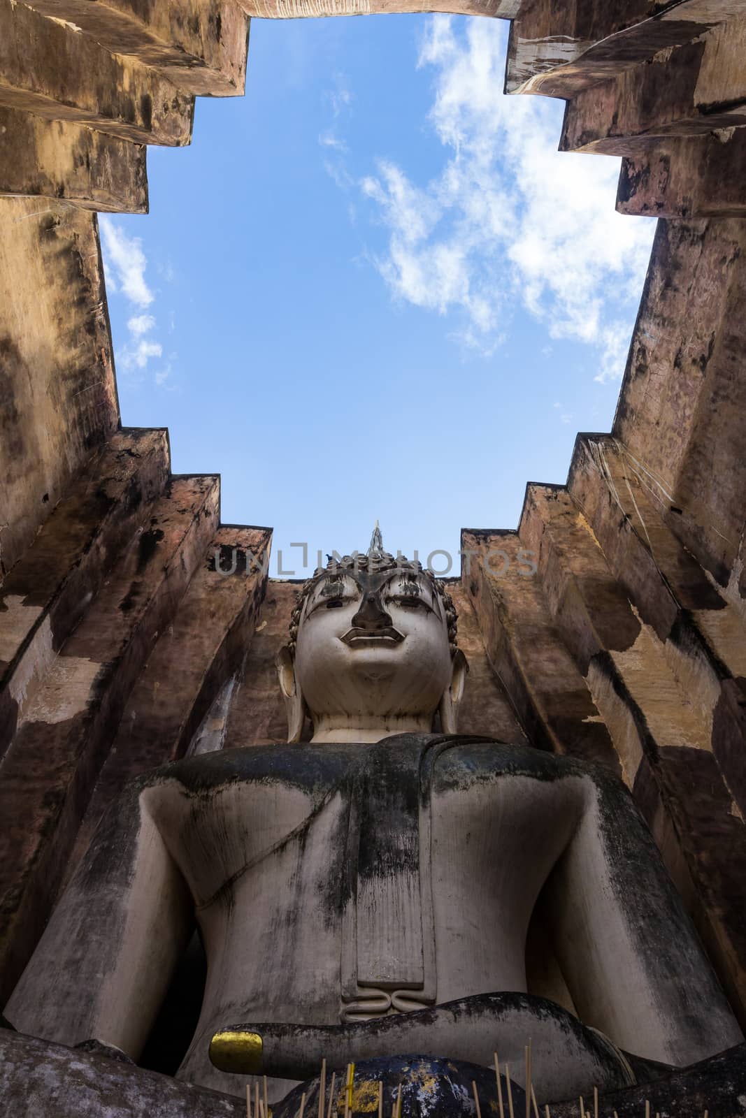 Sri Chum Temple is an ancient monument in the Sukhothai Historical Park. This temple is enshrined by the large Buddha, which is called "Phra Ajarna".  : Sukhothai,Thailand - JULY,01,2018