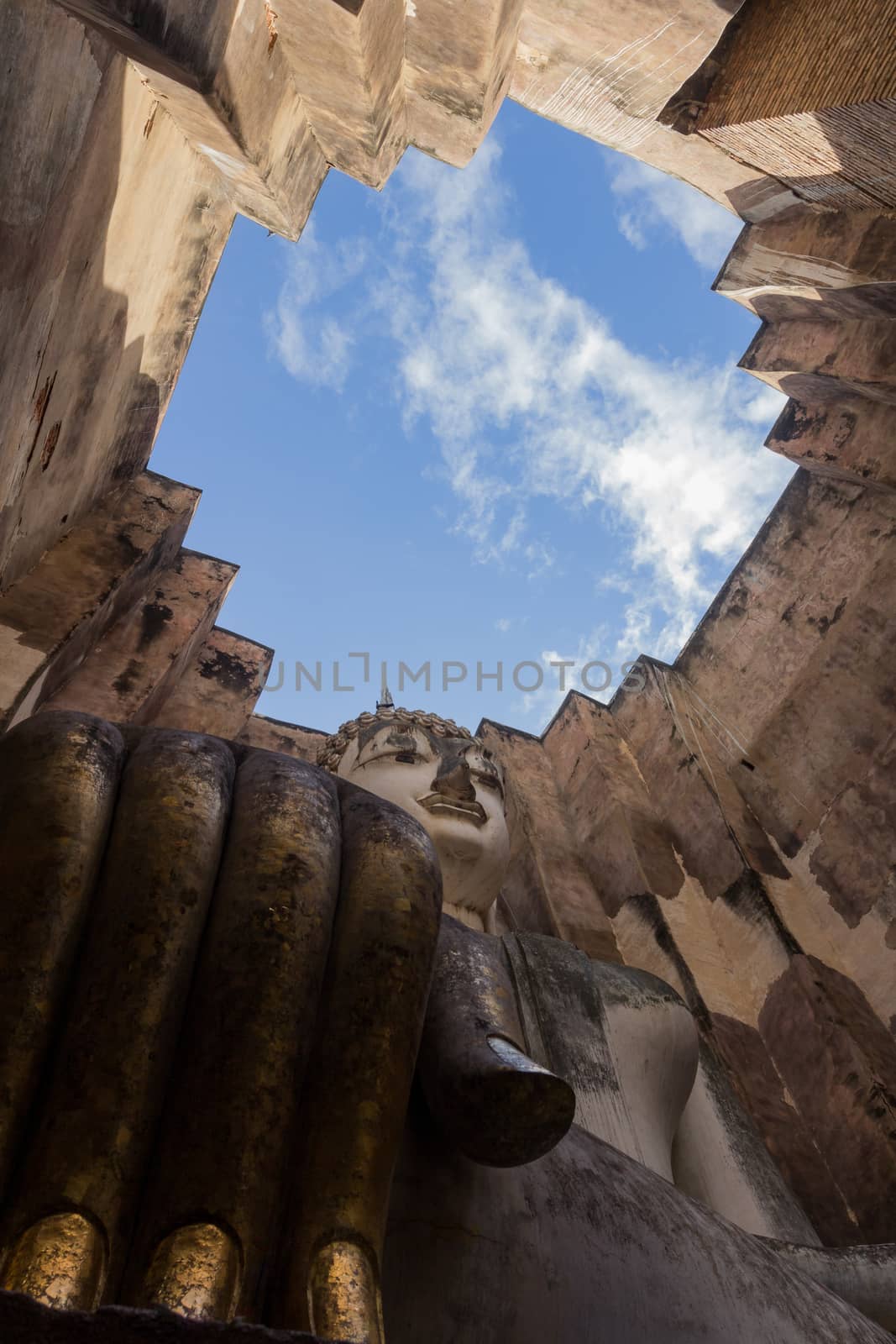 Sri Chum Temple is an ancient monument in the Sukhothai Historical Park. This temple is enshrined by the large Buddha, which is called "Phra Ajarna".  : Sukhothai,Thailand - JULY,01,2018