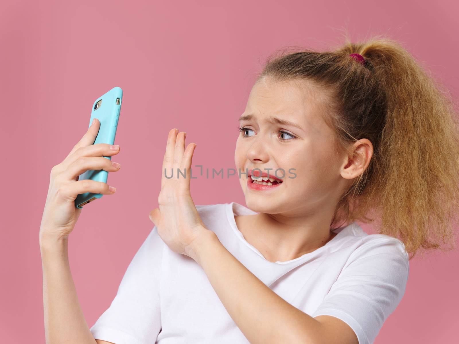 Girl with phone in hands technology communication emotions by SHOTPRIME