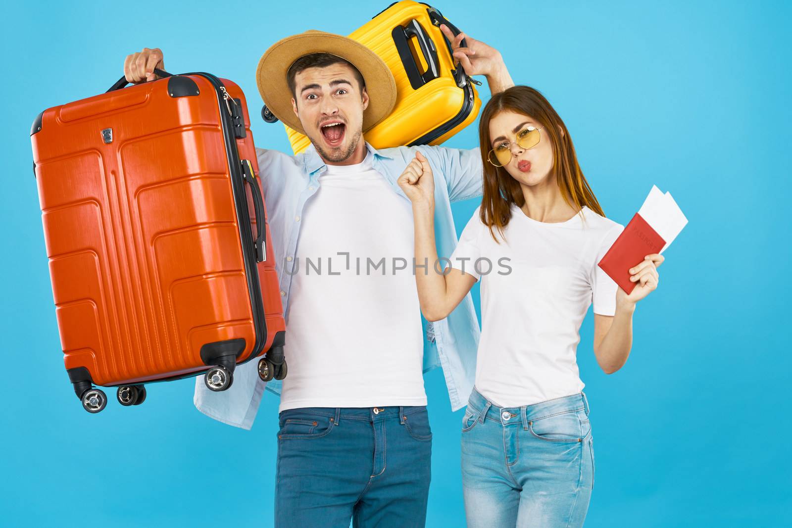 funny couple travel suitcases on vacation passport and plane ticket airport by SHOTPRIME