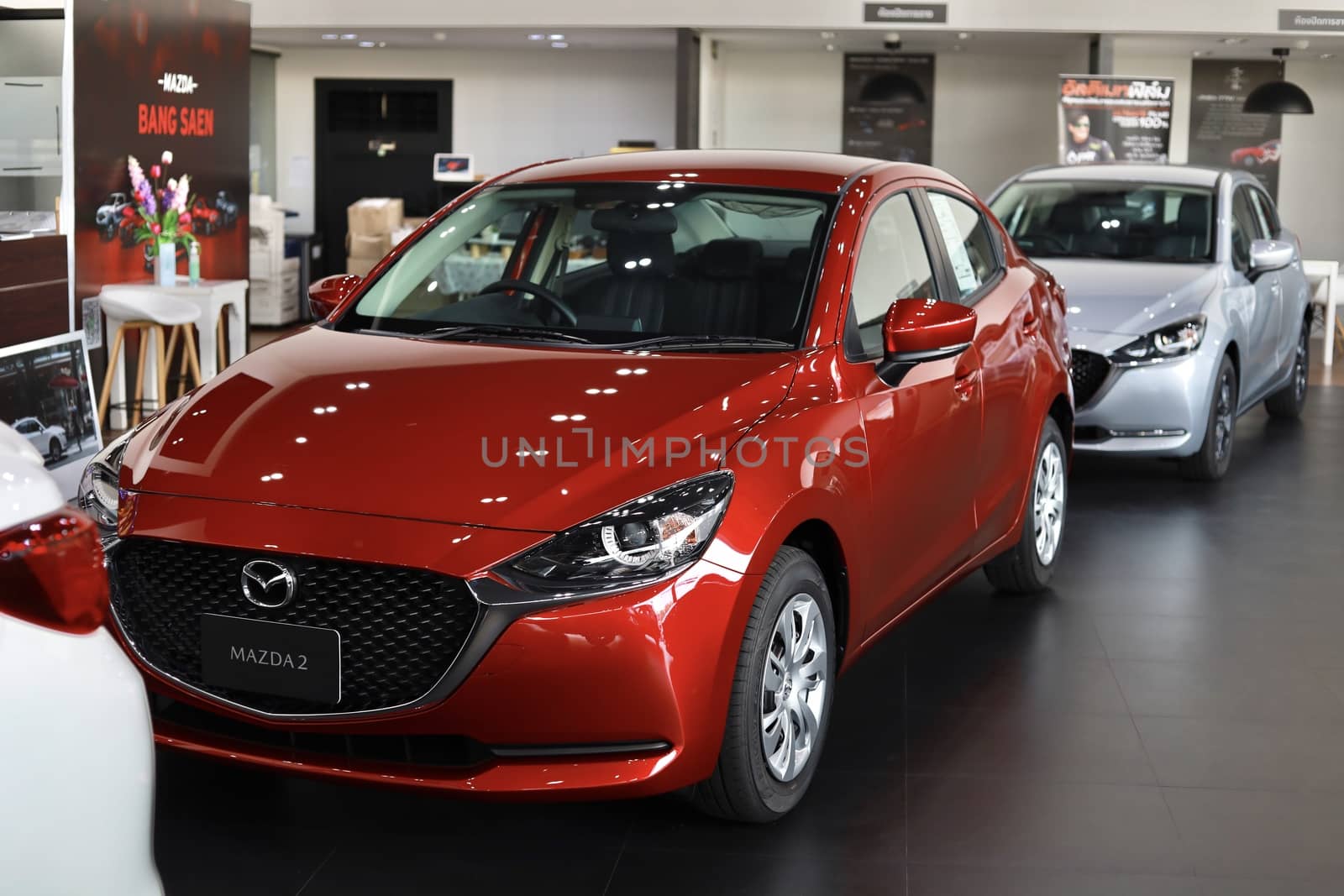 BANGSAEN,THAILAND 2020, car all new MAZDA3 MAZDA2 2020 brand japan red  color on room customer dealership in garage parked in showroom of thailand for transport Illustrative editorial image.