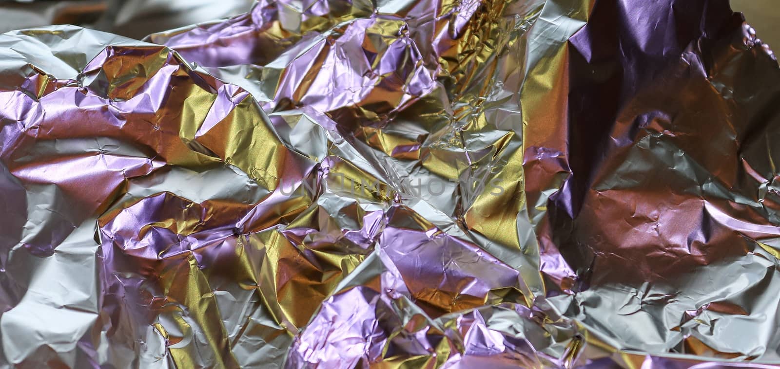 Detailed close up texture of an aluminum foil surface in differe by MP_foto71
