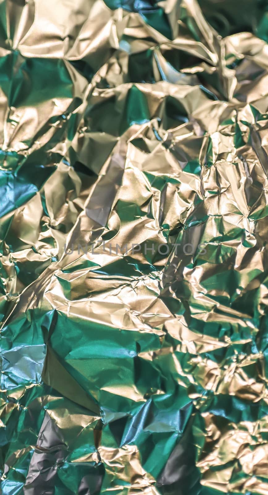 Detailed close up texture of an aluminum foil surface in different colors